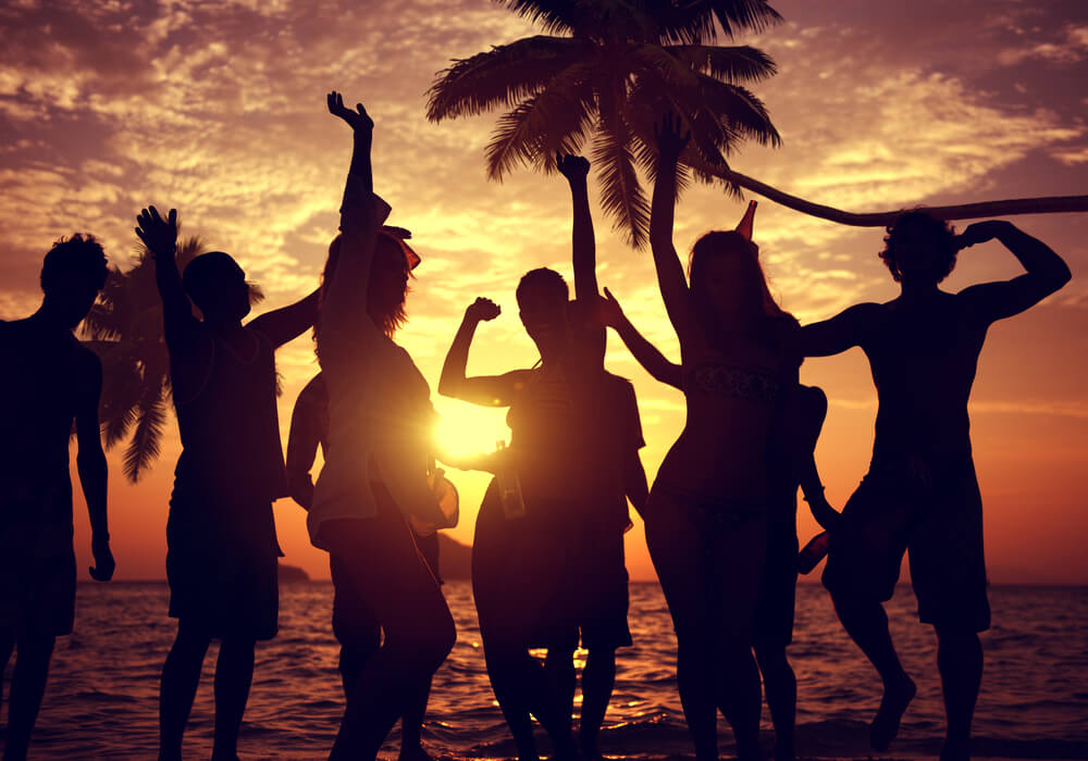 Group of people enjoying a beach party