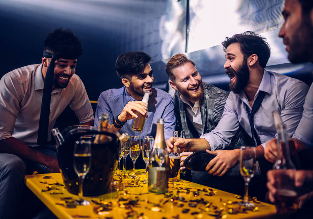 Men having fun in a nightclub on stag do 