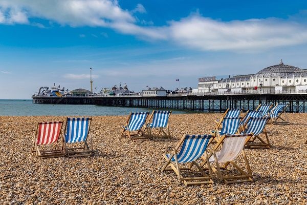 Image of the famous Brighton pebble beach and Brighton pier 