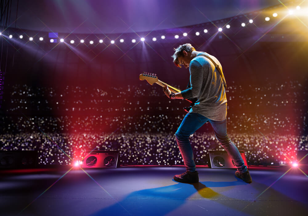 Rockstar performing with guitar