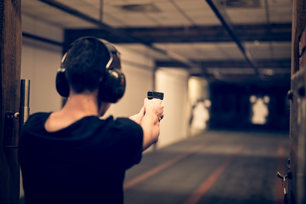 Man trying a shooting experience activity on stag do