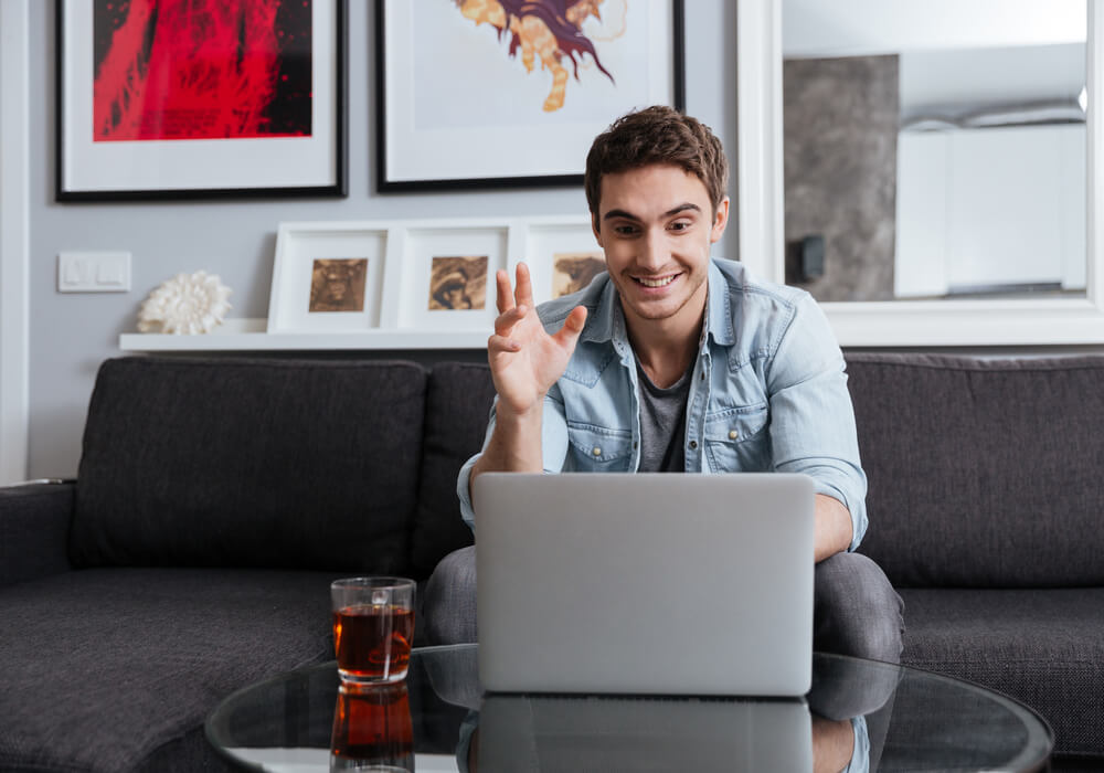 Man getting ready for virtual party with friends