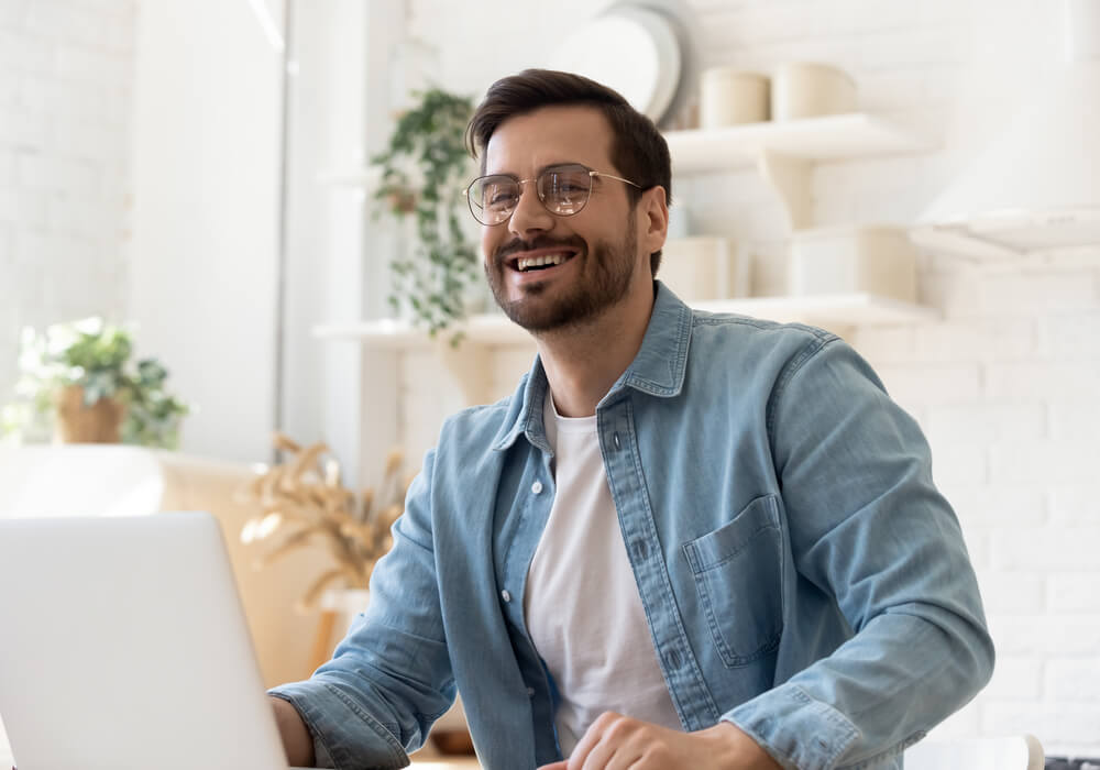 Man playing virtual party games with friends online